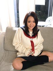 Teen girl Rui Natsukawa poses at her home on the floor and enjoys
